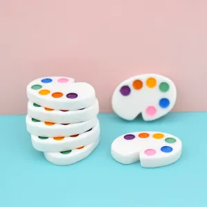 Close-up of colorful mini resin palettes for DIY dollhouse and phone case decoration
