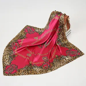 Luxurious 90x90cm square silk scarf featuring a bold baroque chain and chic leopard print design.