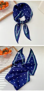 Blue polka dot silk skinny scarf with green and white striped border, stylish hair accessory.