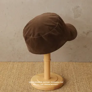 Brown suede cadet cap detail, vintage flat top newsboy hat for women autumn winter style.
