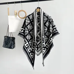 Black and white jacquard knit shawl scarf, vintage baroque pattern with fringe hem detail.