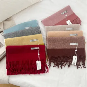 Detailed view of colorful winter woolen tassel scarves, soft cozy material, multiple stylish colors.