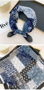 Close-up view of the blue patterned square scarf showing intricate floral prints.