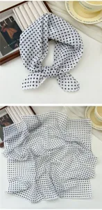 Detailed view of black and white polka dot cotton linen square scarf, close-up texture.
