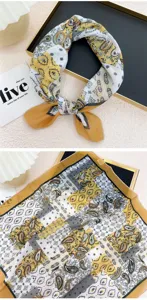 Detail view of the yellow paisley print cotton linen small square scarf hair band neckerchief.