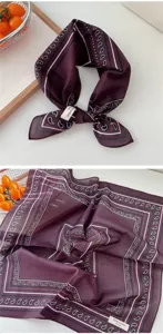 Detail shot of a vintage dark purple paisley print cotton square scarf, soft and retro style.