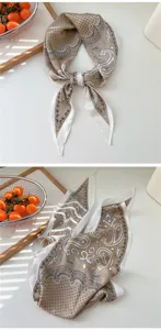 Detailed view of a fashionable polka dot paisley rhombus scarf and stylish hair band.