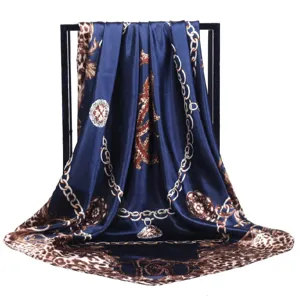 Elegant 90x90cm square silk scarf featuring a chic leopard and chain print design for women.
