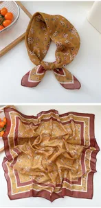 Detailed view of a vintage floral square scarf with brown border, elegant and breathable fabric.