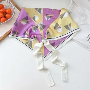 Geometric pattern satin neck scarf with pearl magnetic buckle, elegant detail view.