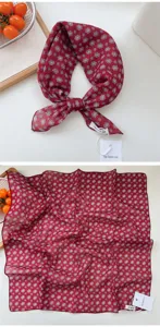 Detailed view of the red cotton linen square scarf featuring delicate geometric print patterns.