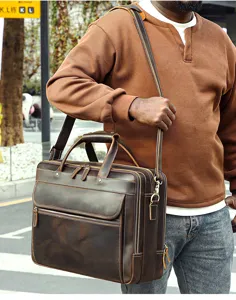 Genuine leather men's briefcase detail showcasing vintage crazy horse texture and metal zippers.
