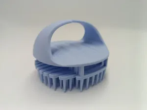 Detailed view of the silicone scalp massage brush with soft bristles for easy hair washing.