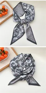 Vista detallada del pañuelo delgado gris con cachemira, elegante cinta para el cuello.
