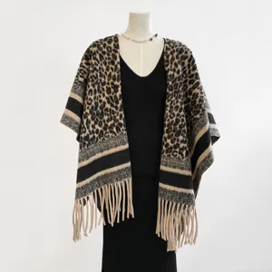 Close-up of the leopard print faux cashmere shawl with stylish fringe and contrast stripes.