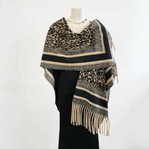 Elegant leopard print thermal cashmere-feel shawl cape with chic fringe trim for winter.