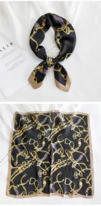 Vista detallada del pañuelo cuadrado de seda negro y oro con estampado de cadena, elegante.