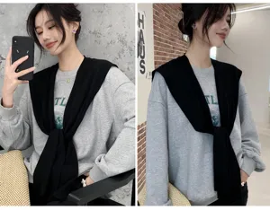 Detailed shot of fashionable black knit shawl, ideal for summer air-conditioned rooms and autumn.