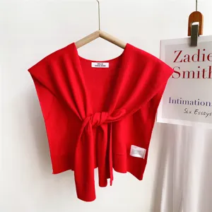 Red knitted shoulder wrap shawl detail, stylish tying sweater scarf for women, cozy layer.