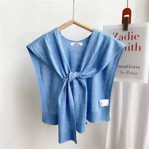Solid color knitted small shawl for women, stylish tie-front fake sleeve sweater top for daily wear.
