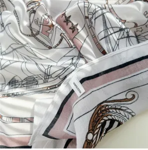 Close-up detail of the elegant nautical print scarf fabric, showing clean stitching and label.