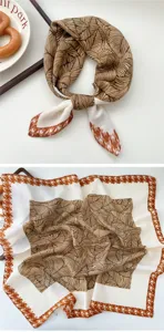 Elegant women's square scarf with leaf pattern and houndstooth border for chic styling.