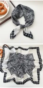 Close-up detail showing the black and white leaf pattern and classic houndstooth border design.