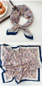 Detailed view of women's fashion paisley print square scarf with classic blue border design.