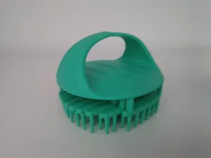Green silicone scalp massage shampoo brush detail, soft bristles for hair washing and care