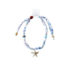 Stoffen lint ketting met zeester hanger, een elegante zomerse strand halsdoek voor vrouwen.