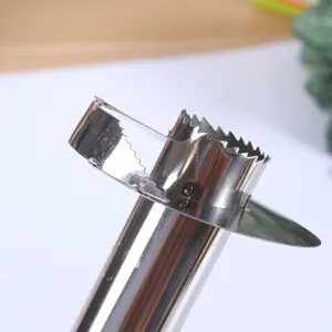 Stainless steel pineapple corer detail view, sharp serrated blade for easy kitchen fruit preparation.