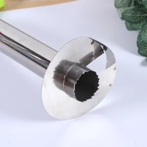 Stainless steel pineapple corer and slicer kitchen tool for easy fruit peeling and cutting.