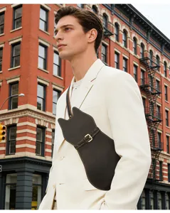 Detailed shot of genuine leather cat shaped crossbody bag, unique crazy horse leather design.