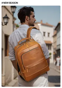 Detail view of men's brown leather backpack, showing large capacity and premium cowhide texture.