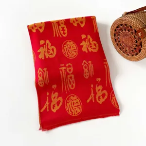 Festive red winter scarf with woven gold blessing characters, elegant fringe holiday gift shawl.