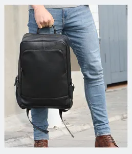 Sac à dos d'affaires en cuir véritable pour homme, avec des compartiments spacieux.