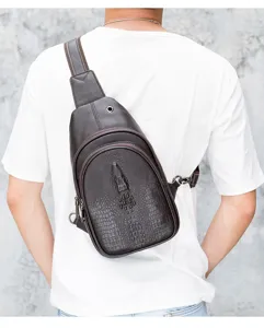 Detailed view of brown leather chest bag with crocodile texture, perfect for outdoor casual wear.