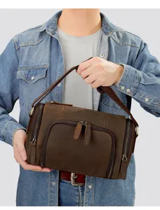 Detail view of the brown crazy horse leather men shoulder bag with multiple zippered pockets.