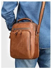 Vintage genuine leather shoulder bag detail view, casual crossbody bag for men everyday use.
