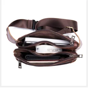 Genuine leather men waist bag multi-functional chest bag with multiple zipper compartments.