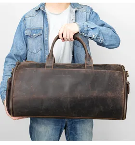 Detail view of genuine leather travel duffel bag for men, large capacity and durable cowhide.