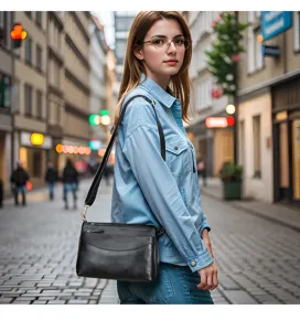 Black leather women's crossbody shoulder bag street lifestyle detail view design daily use