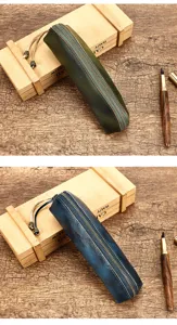 Detailopname van het vintage pennenetui van plantaardig gelooid leer met handige rits.
