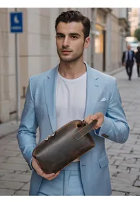 Detail view of men's genuine leather clutch bag, large capacity vintage toiletry bag for daily use.