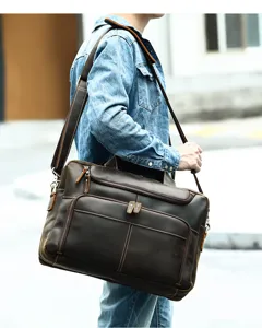 Vintage genuine leather messenger bag detail view showing multiple zippered pockets and strap