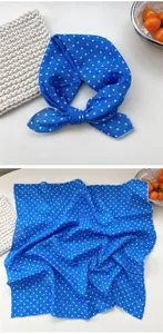 Detail view of blue polka dot square scarf, versatile bandana and stylish neck wrap accessory.