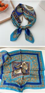 Close-up detail of a blue and gold baroque print silk square scarf, elegant design.