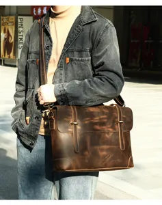 Vintage brown crazy horse leather men briefcase, detailed view of retro messenger bag.