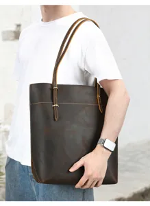Men's vintage crazy horse leather tote bag detail view showing texture and hardware