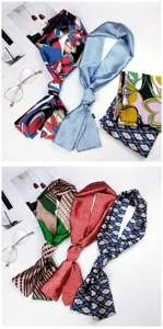 Detailed view of fashionable printed silk twilly scarves with geometric and floral patterns.